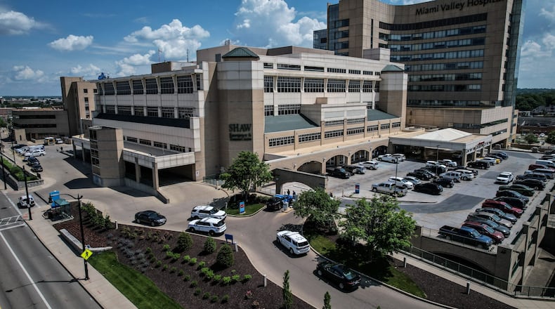 Police officers were outside Miami Valley Hospital Wednesday June 1, 2022, after a Montgomery County Jail inmate and a private security guard died in a shooting. JIM NOELKER/STAFF