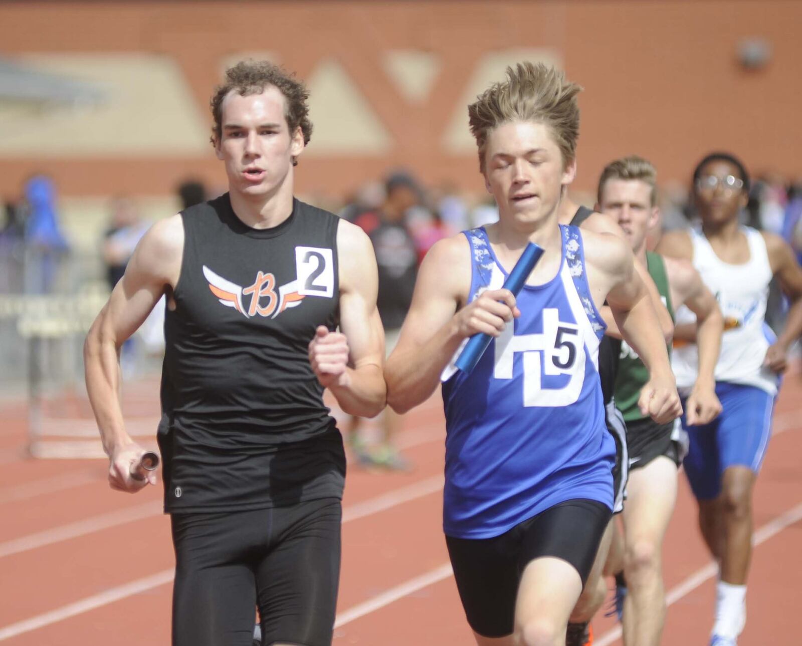 Anchor Ben Ewert of Beavercreek (left) overtook Hilliard Davidson’s Andrew Tighe (right) to win the distance medley relay during the Wayne track and field invitational at Huber Heights on Thursday, April 27, 2017. MARC PENDLETON / STAFF