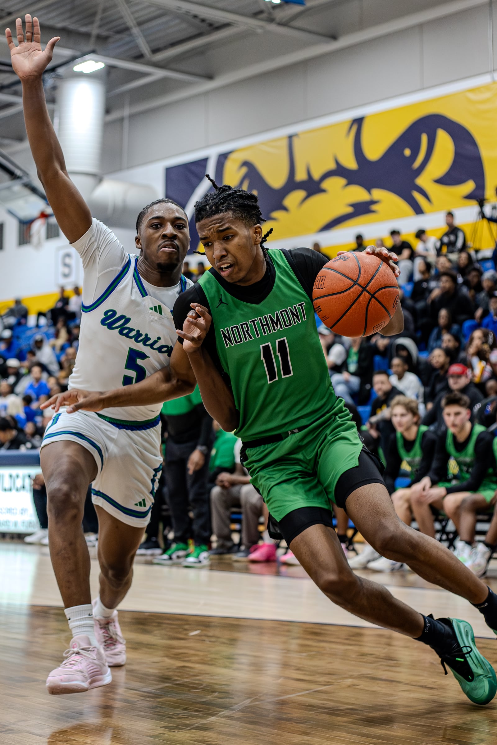 Northmont High School sophomore Kaleb Kelly drives past Winton Woods senior Nate Dawson during their Division II regional semifinal game on Wednesday, March 11, 2026, at Springfield High School. Winton Woods won 66-51. MICHAEL COOPER / STAFF