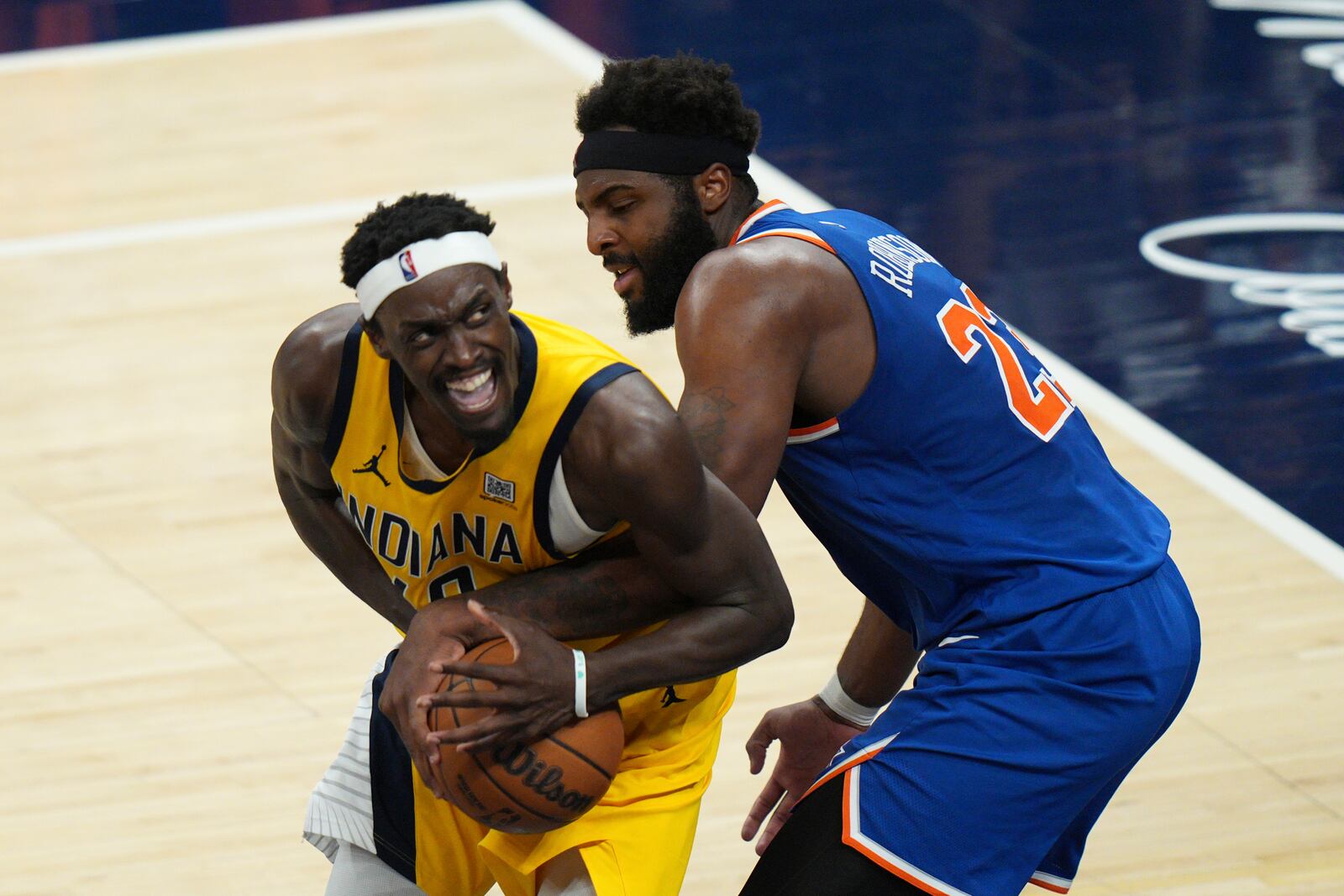 New York Knicks center Mitchell Robinson (23) defends against Indiana Pacers forward Pascal Siakam, left, during the second half of Game 6 of the Eastern Conference finals of the NBA basketball playoffs in Indianapolis, Saturday, May 31, 2025. (AP Photo/AJ Mast)