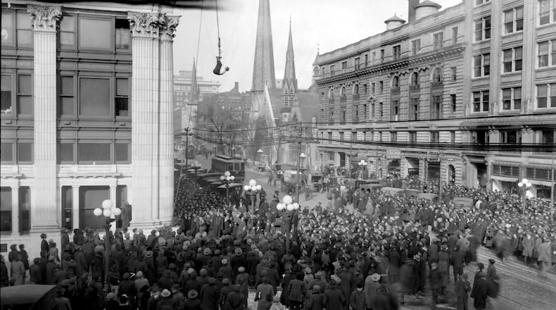 In 1916 magician Harry Houdini escaped from a police straight jacket while suspended from the Dayton Daily News building head down. The newspaper reported it took him just three minutes to free himself. DAYTON HISTORY MAYFIELD COLLECTION