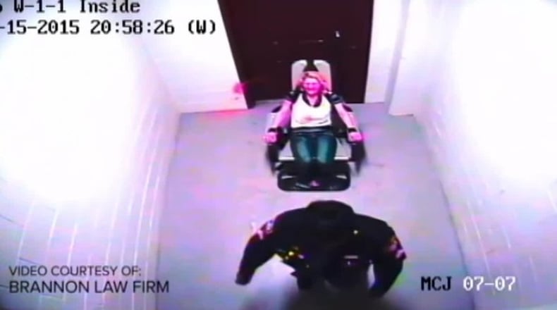 Capt. Judy Sealey, who was promoted from sergeant early in 2016, turns away from Amber Swink after she used pepper spray against Swink while the inmate was bound in a 7-point harness in the Montgomery County Jail in November 2015. FILE