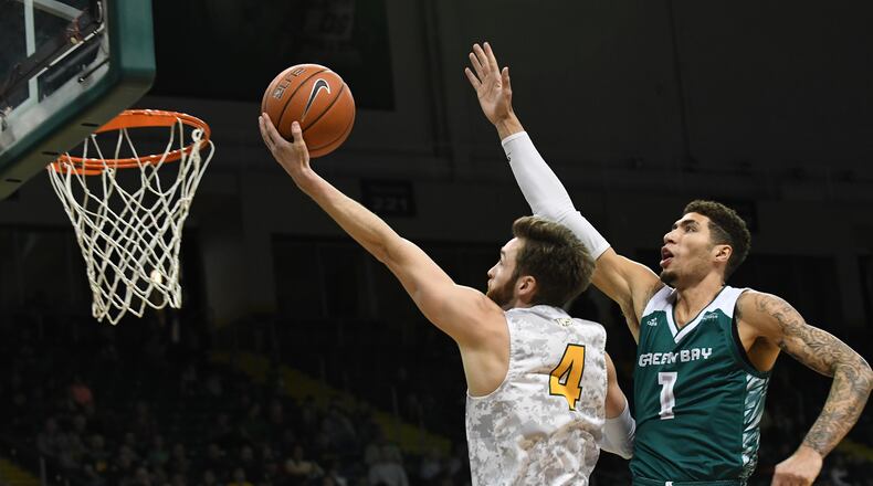 Wright State’s Alan Vest puts up a shot as Green Bay’s Sandy Cohen defends during a game earlier this season at the Nutter Center. Keith Cole/CONTRIBUTED