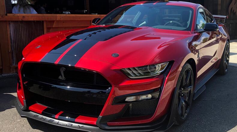 In this Tuesday, July 31, photo the the 2020 Shelby GT500 is displayed during a Ford press conference in the Detroit suburb of Clawson, Mich. The Mustang will be the most powerful street-legal Ford Mustang ever built and will go on sale this fall. (AP Photo/Tom Krisher)