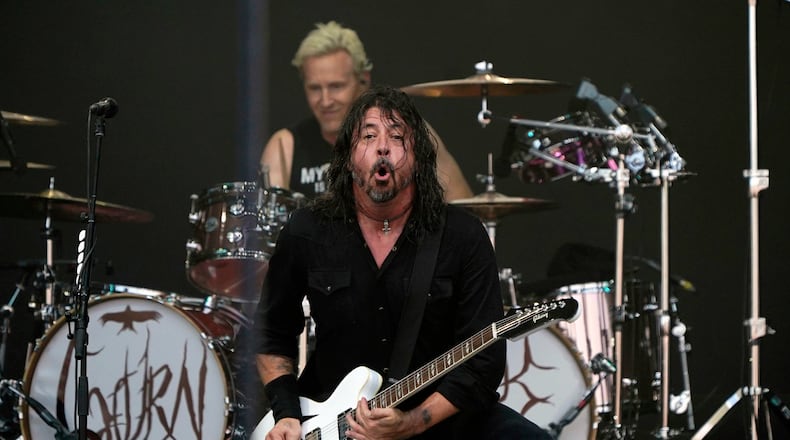 The Foo Fighters performs under the name 'The ChurnUps', on the Pyramid stage at the Glastonbury Festival at Worthy Farm in Somerset, England, Friday, June 23, 2023. (Yui Mok/PA via AP)