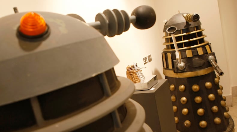 FILE - Two full size Daleks from the BBC TV series Doctor Who, dating from the late 1970,s to 1988 and used in the series 'Remembrance of the Daleks' at Bonhams auction house in London, Monday, Aug. 2, 2010. (AP Photo/Alastair Grant, file)