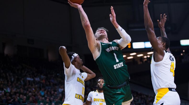 Wright State’s Bill Wampler looks to score inside against NKU’s Adrian Nelson (4) and Jalen Tate (11) at the Nutter Center on Jan. 24, 2020. Joseph Craven/WSU Athletics