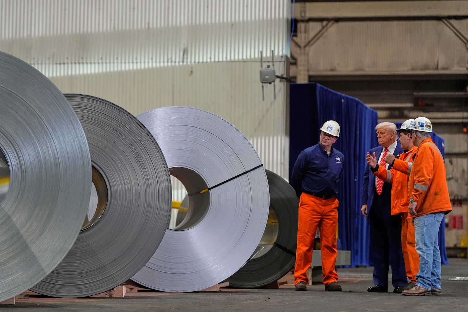 President Donald Trump talks to workers as he tours U.S. Steel Corporation's Mon Valley Works-Irvin plant, Friday, May 30, 2025, in West Mifflin, Pa. (AP Photo/Julia Demaree Nikhinson)