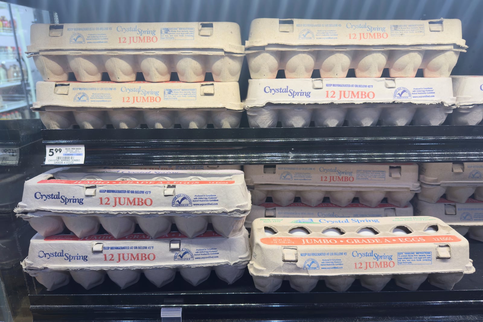 Eggs are displayed in a grocery store in Carmel, Ind., Wednesday, April 9, 2025. (AP Photo/Michael Conroy)