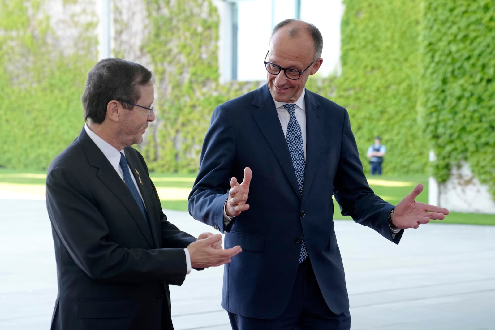 FILE - German Chancellor Friedrich Merz, right, welcomes Israeli President Isaac Herzog for a meeting at the chancellery in Berlin, Germany, on May 12, 2025. (AP Photo/Markus Schreiber, File)