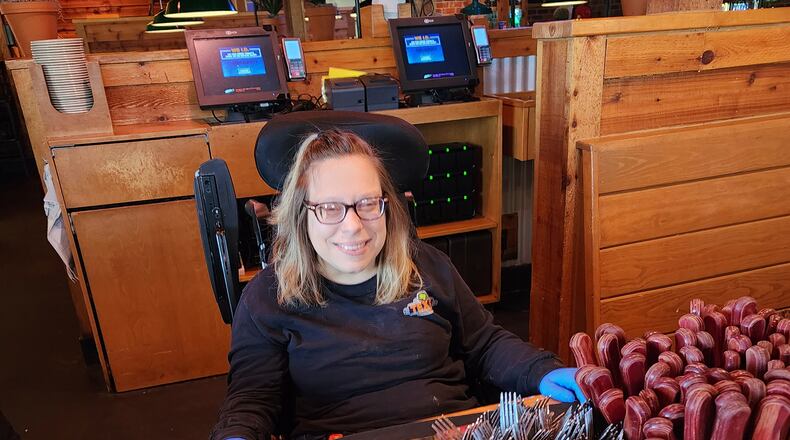 Amy Zahora found her dream job as a silverware roller at Texas Roadhouse in Fairborn after working with Boundless, a Dayton based organization that helps people with developmental and intellectual disabilities create "boundless" lives and learn to live independently. CONTRIBUTED