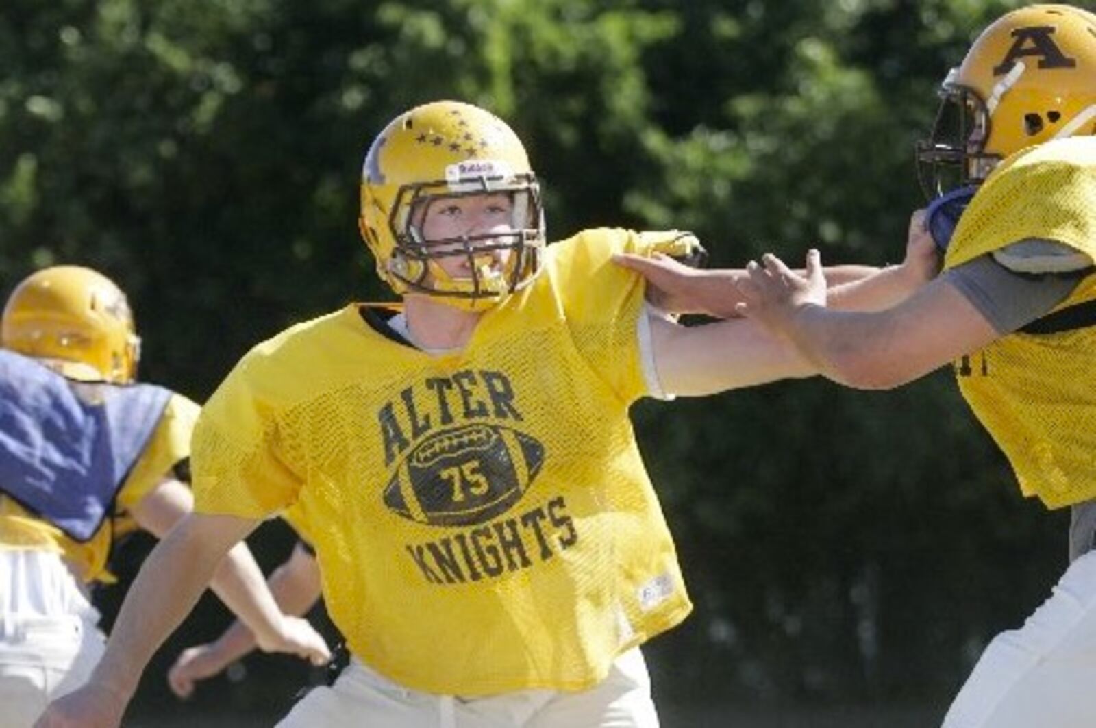Joe Thuney practices on the defensive line during an Alter High School football scrimage in 2010. Ron Alvey/Staff