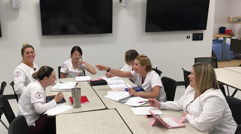 Students work in Sinclair Community College’s new health sciences building. Sinclair is a key partner in the region’s effort to help more students earn degrees and credentials. MAX FILBY / STAFF