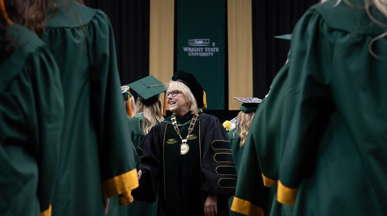 Wright State president Susan Edwards shakes hands during the Wright State University graduation ceremonies April 27-29, 2023. CONTRIBUTED/WRIGHT STATE