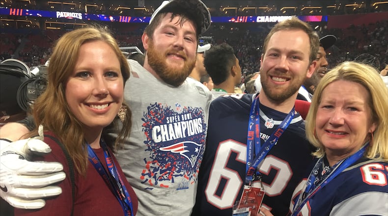 Four members of the Thuney family -- Monica, Joe, Eric and Beth -- celebrate on the field after the Patriots' win over the Rams in Super Bowl LIII on Feb. 3, 2019, in Atlanta, Ga.