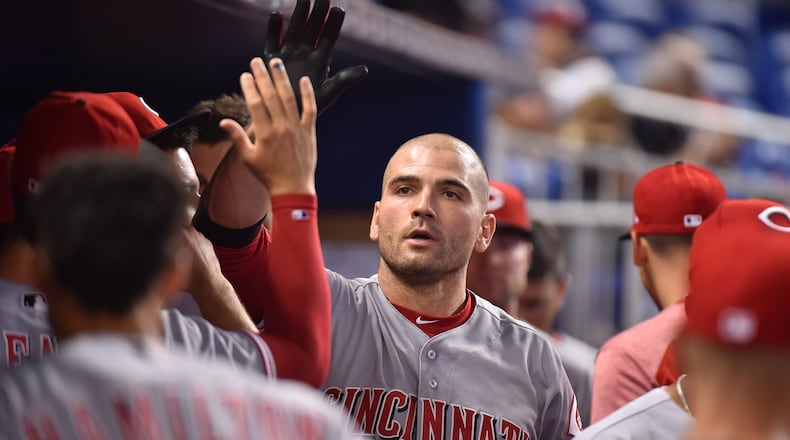 MIAMI, FL - JULY 29: Joey Votto #19 of the Cincinnati Reds is congratulated by teammates after hitting a home run in the first inning against the Miami Marlins at Marlins Park on July 29, 2017 in Miami, Florida. (Photo by Eric Espada/Getty Images)