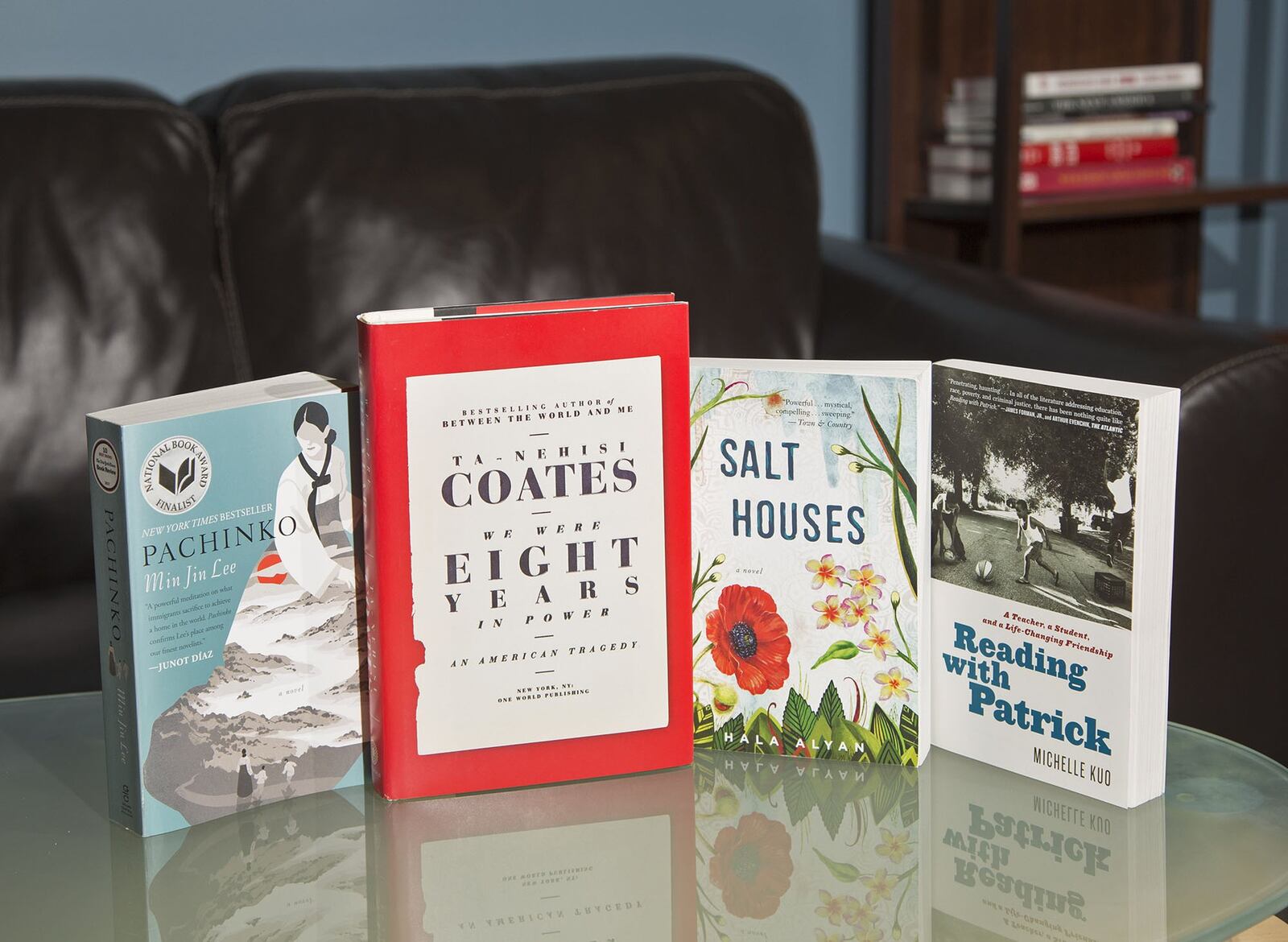 The books from Dayton Literary Peace Prize winners: “We Were Eight Years in Power” by Ta-Nehisi Coates, “Salt Houses” by Hala Alyan, and runners-up “Pachinko” by Min Jin Lee and “Reading with Patrick” by Michelle Kuo. TY GREENLEES / STAFF