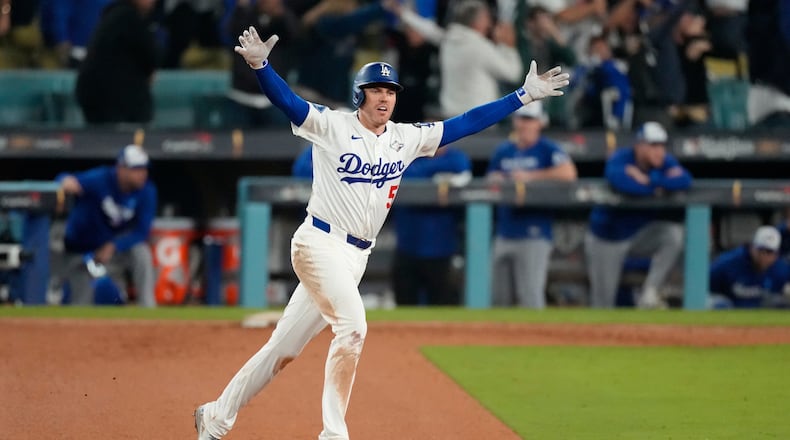 Los Angeles Dodgers' Freddie Freeman celebrates his walk off home run against the Toronto Blue Jays during the 18th inning in Game 3 of baseball's World Series, Monday, Oct. 27, 2025, in Los Angeles. (AP Photo/Mark J. Terrill)