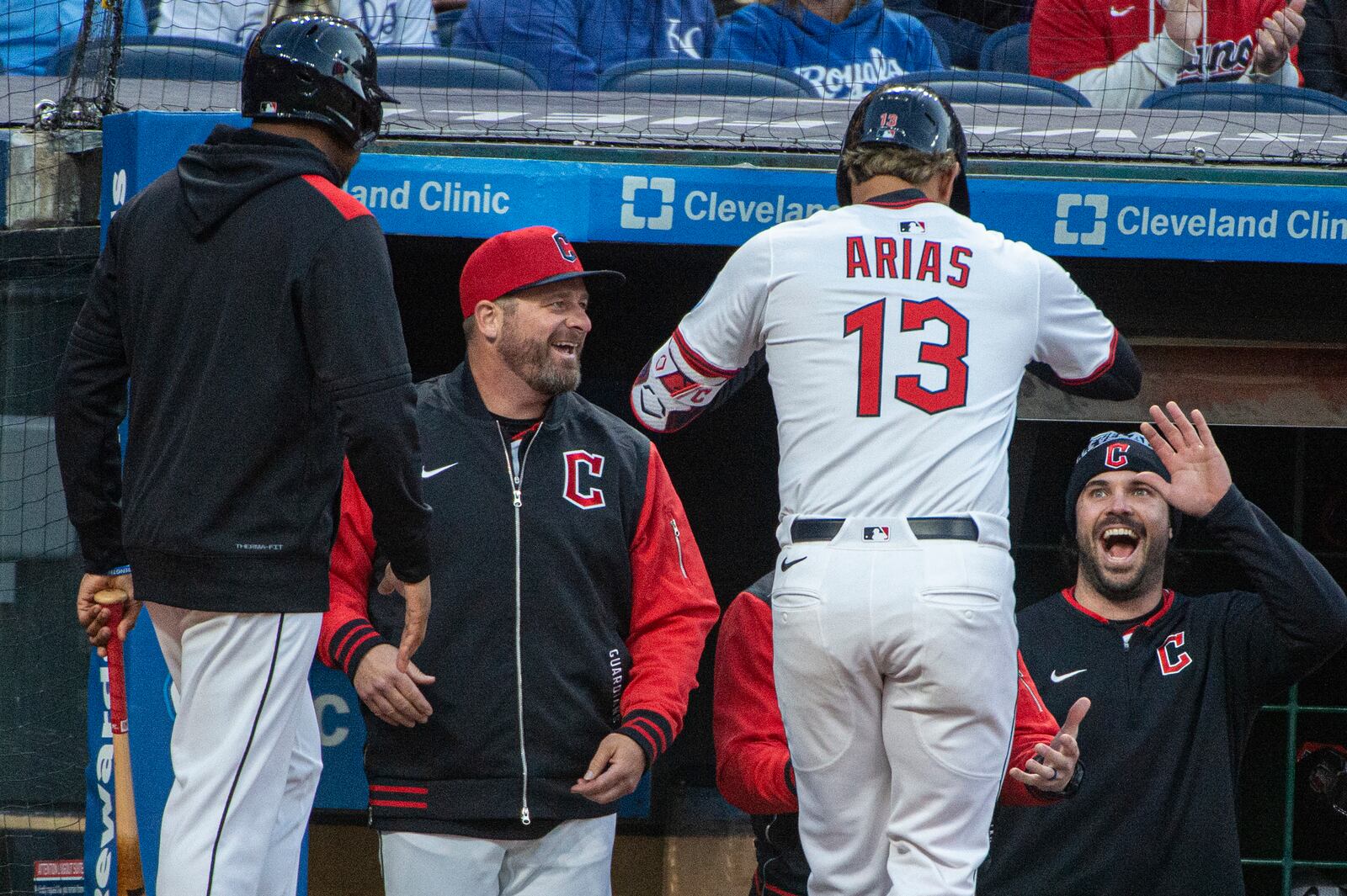 Cleveland Guardians' Gabriel Arias (13) is greeted by manager Stephan Vogt, second from left, and Austin Hedges, right, after hitting a solo home run off Kansas City Royals starting pitcher Michael Lorenzen during the sixth inning of a baseball game in Cleveland, Saturday, April 12, 2025. (AP Photo/Phil Long)