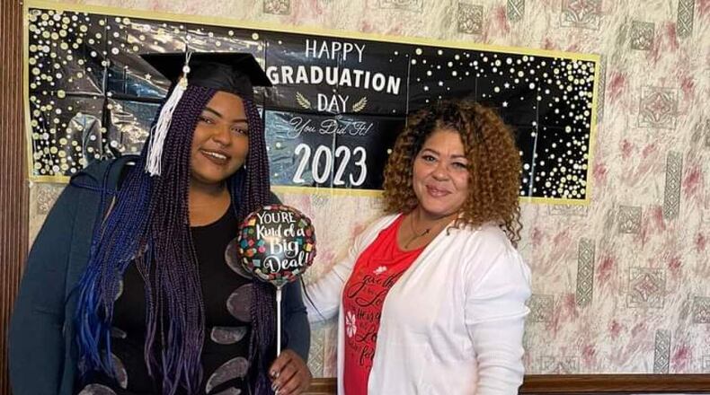 Keziah Lewis, left, graduates from the University of Cincinnati on April 29, nearly six years after she survived an Ohio State Fair ride crash that killed her boyfriend, Tyler Jarrell. CLARISSA WILLIAMS VIA WCPO/CONTRIBUTED