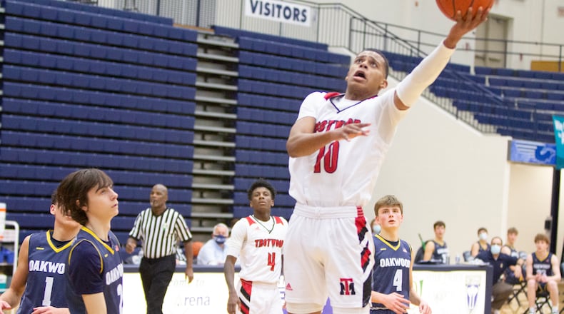 Anthony McComb of Trotwood-Madison against Oakwood in a Division II sectional tournament game. Jeff Gilbert/CONTRIBUTED