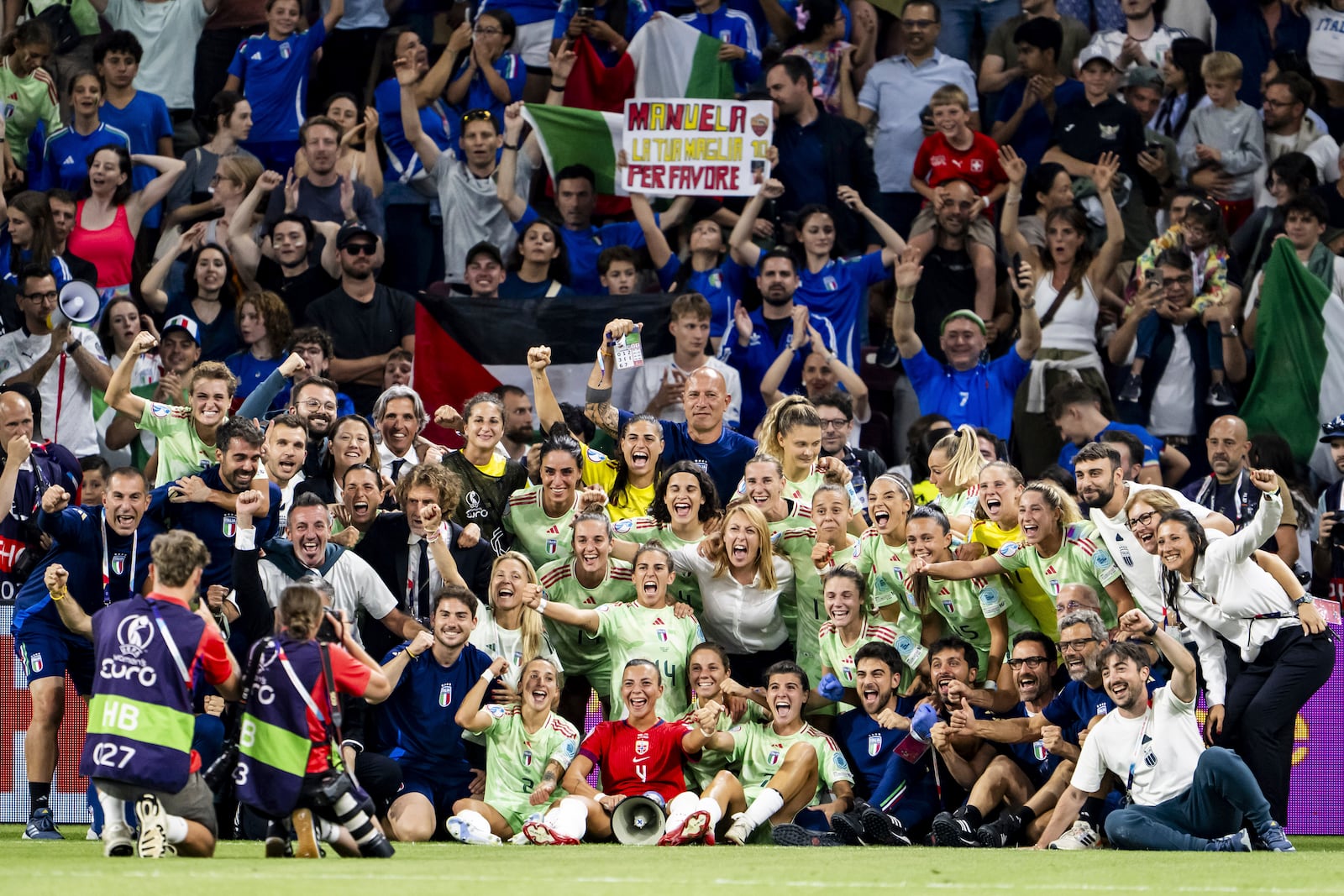 Soccer players and staff from Italy celebrate their victory after the Women's Euro 2025 quarterfinals soccer match between Norway and Italy at Stade de Geneve in Geneva, Switzerland, Wednesday, July 16, 2025. (Jean-Christophe Bott/Keystone via AP)