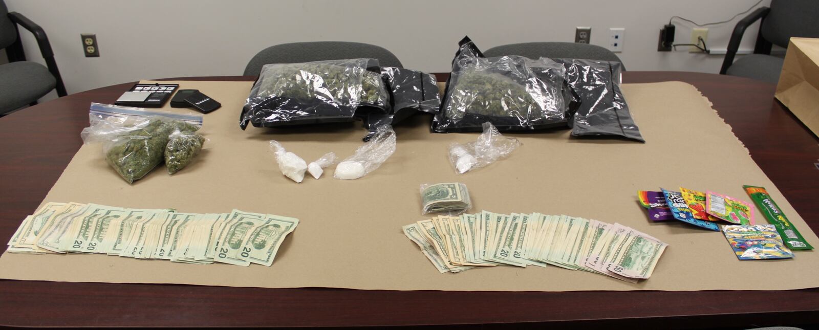 Cocaine, marijuana, drug paraphernalia and cash were seized Friday from a house in the 800 block of Nicklin Avenue in Piqua while authorities were searching for a suspect in a narcotics trafficking case.