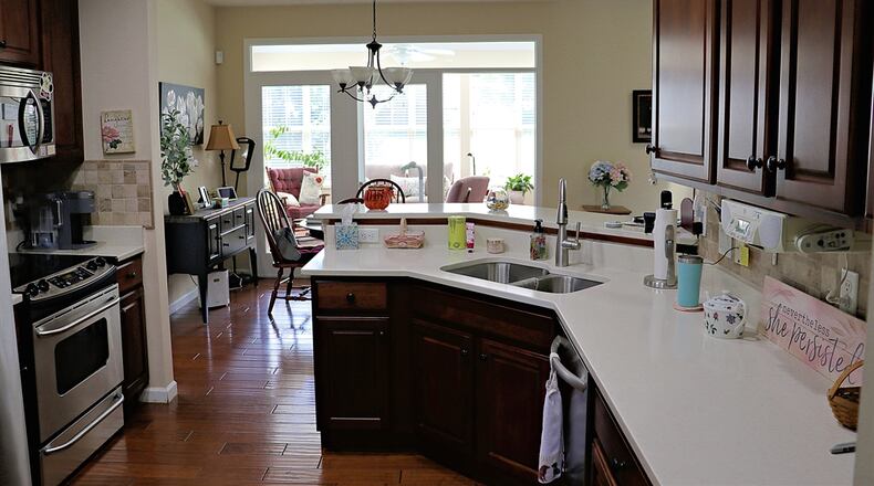 A two-level peninsula counter wraps around the kitchen, dividing the kitchen from the dining area but also allowing for extra counter space. Contributed by Kathy Tyler