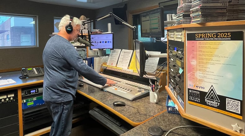 WYSO's Jerry Kenney, who hosts All Things Considered, stands in the studio at the radio station's Yellow Springs office.