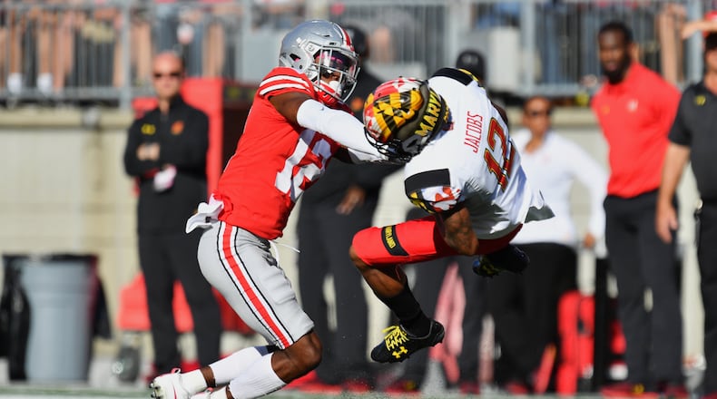 COLUMBUS, OH - OCTOBER 7:  Denzel Ward #12 of the Ohio State Buckeyes hits Taivon Jacobs #12 of the Maryland Terrapins after a reception in the first quarter at Ohio Stadium on October 7, 2017 in Columbus, Ohio. Ward was ejected from the game after being assessed a targeting penalty for the hit.  (Photo by Jamie Sabau/Getty Images)