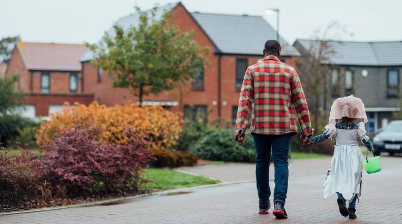 Walking around the neighborhood with young family members? A flashlight is a must. Also consider wearing reflective clothing and comfy shoes. iSTOCK/COX
