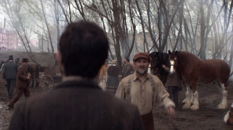 This photo provided by Budweiser shows a scene from the company's commercial for Super Bowl 51, between the New England Patriots and Atlanta Falcons, Sunday, Feb. 5, 2017. The scene depicts when Anheuser-Busch co-founder Adolphus Busch, foreground left, is welcomed to St. Louis after traveling by boat from Germany. (Budweiser via AP)