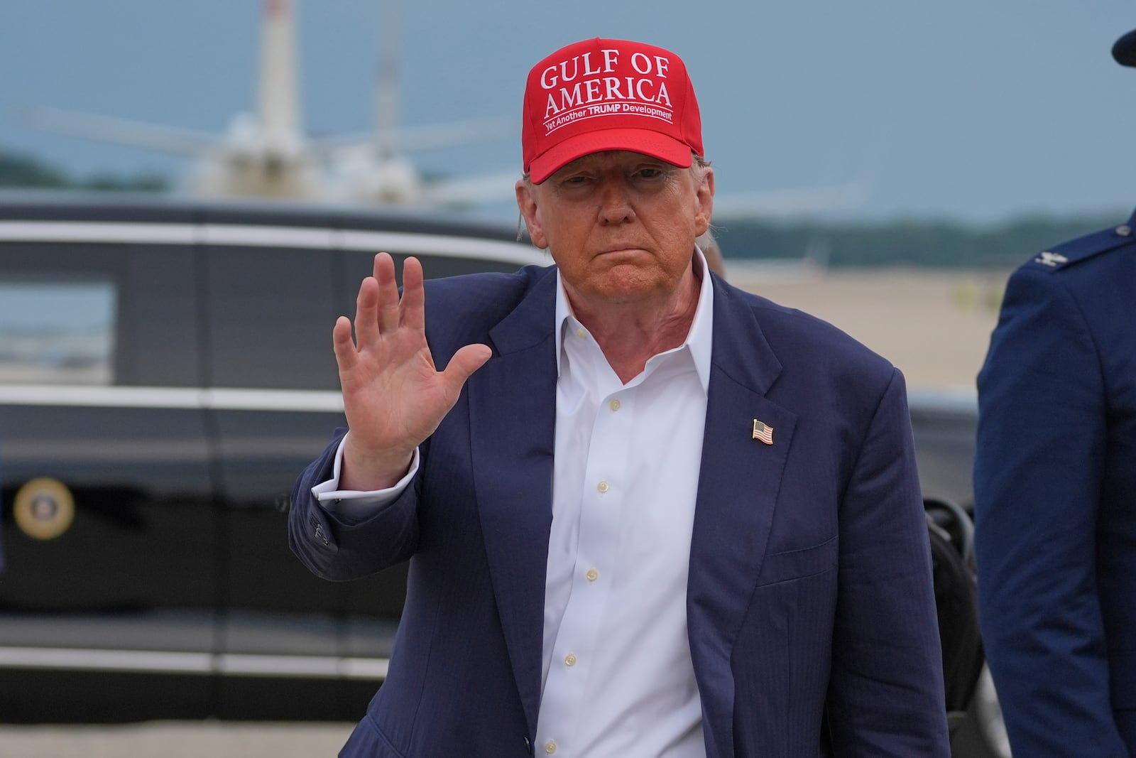 President Donald Trump waves as he arrives at Joint Base Andrews, Md., after visiting a migrant detention center in Ochopee, Fla., Tuesday, July 1, 2025. (AP Photo/Evan Vucci)