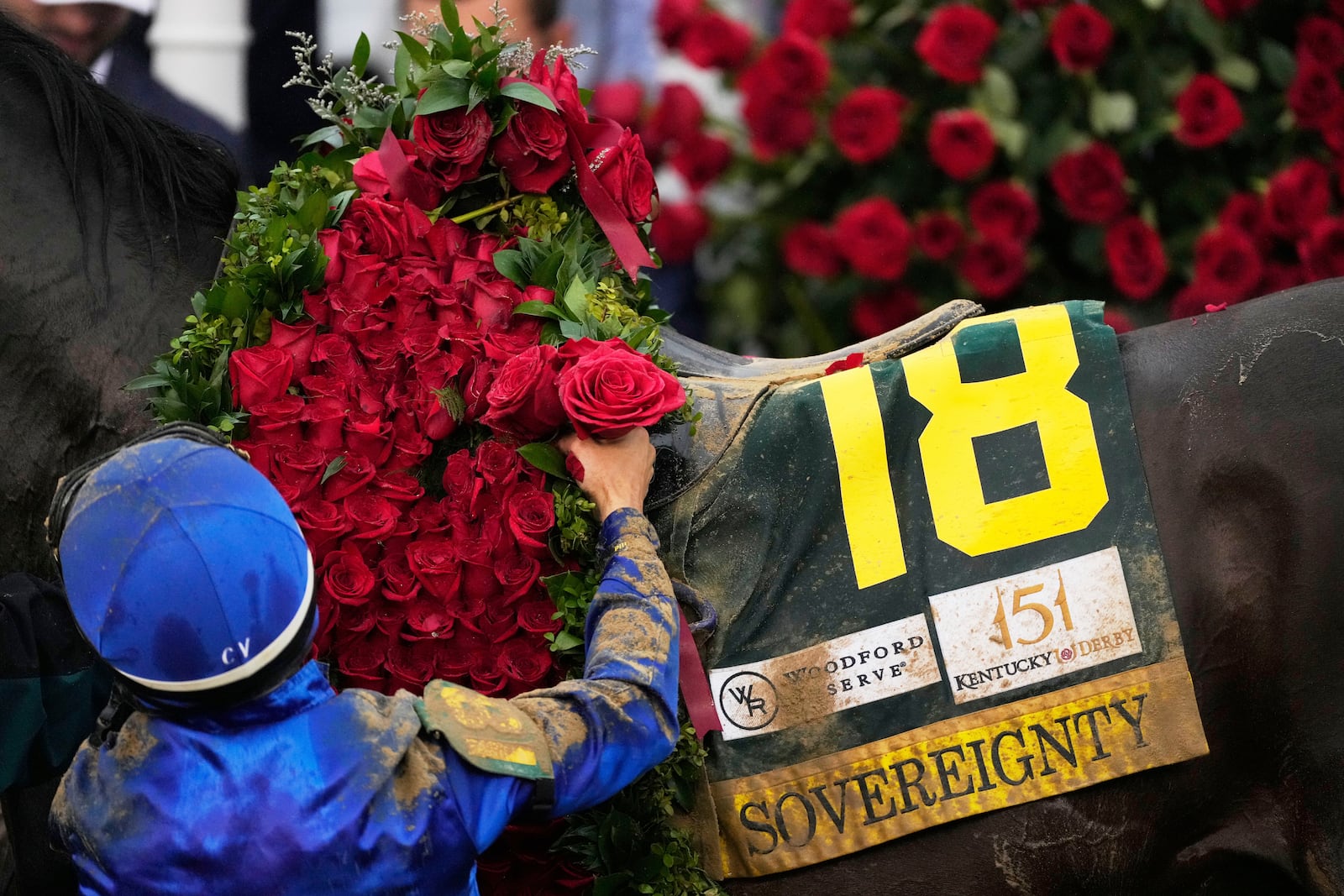 Jockey Junior Alvarado celebrates after riding Sovereignty to victory in the 151st running of the Kentucky Derby horse race at Churchill Downs Saturday, May 3, 2025, in Louisville, Ky. (AP Photo/Brynn Anderson)