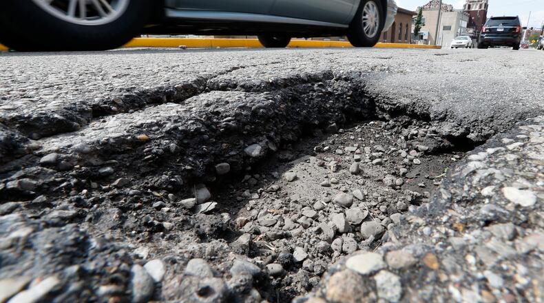 The Butler County Engineer’s Office plans to spend about $500,000 more to resurface roads in 2018. STAFF FILE PHOTO