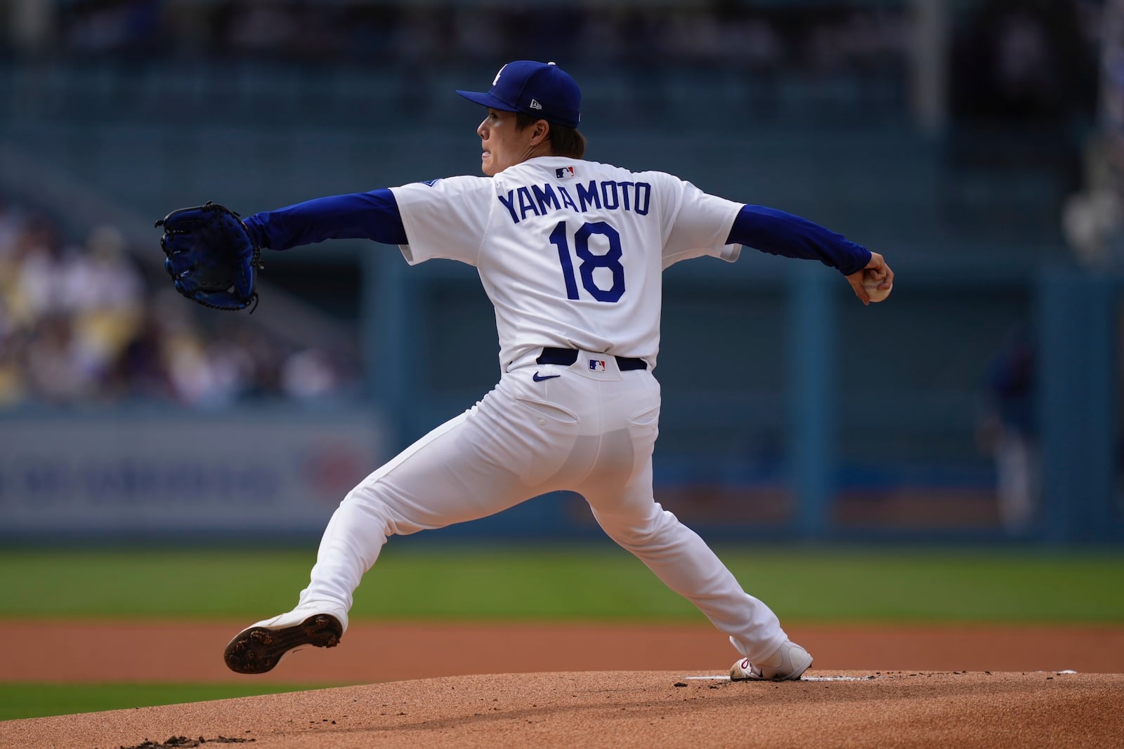 Los Angeles Dodgers starting pitcher Yoshinobu Yamamoto throws to the plate during the first inning of a baseball game against the New York Yankees, Sunday, June 1, 2025, in Los Angeles. (AP Photo/Mark J. Terrill)