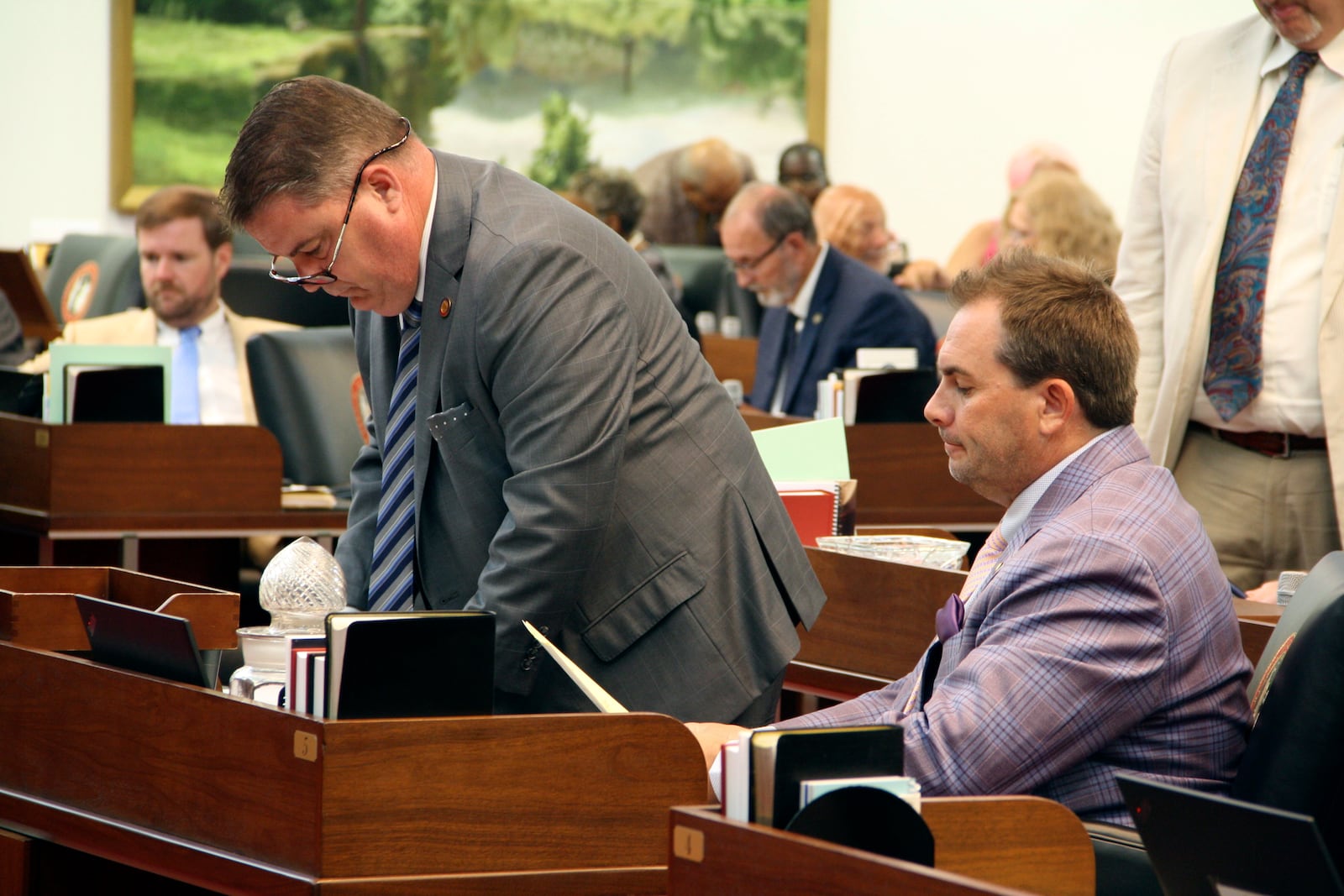 FILE - Rep. Brenden Jones, R-Columbus, stands beside Rep. John Bell, R-Wayne, at his desk ahead of extensive debate on the House floor at the Legislative Building in Raleigh, N.C., on Wednesday, June 26, 2024. (AP Photo/Makiya Seminera, File)