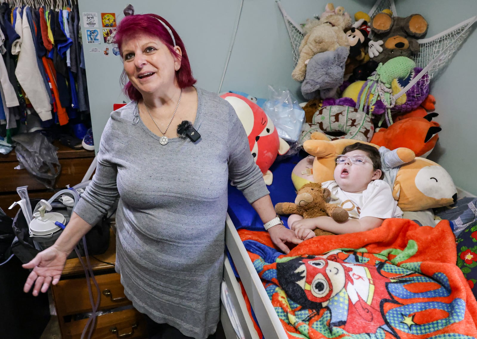Mindi Wynne (left) talks about her grandson Ezra (right) in their Perry Township home on Friday, Feb. 20. Wynne is one of many area homeowners feeling the effects of higher electricity bills. Wynne's household has heavy electric use, but it's mainly stayed steady while their bills have skyrocketed. BRYANT BILLING / STAFF
