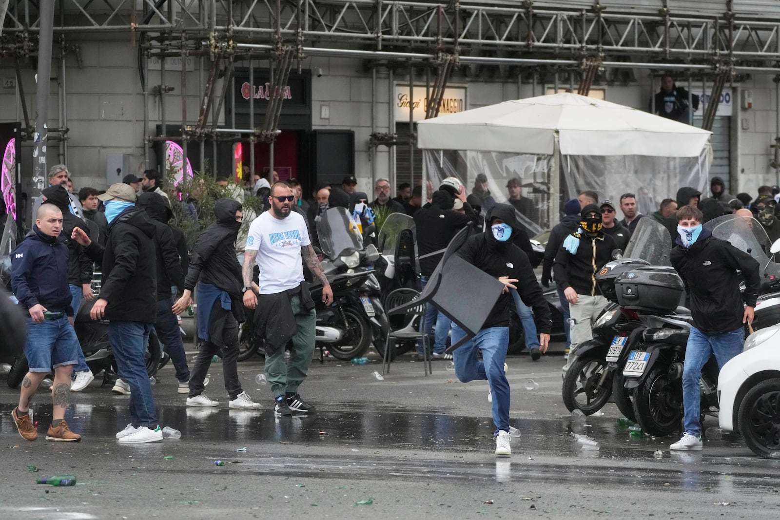 Lazio fans riot with police ahead of the Italian Serie A soccer match between Lazio and Roma at Rome's Olympic stadium, Sunday, April 13, 2025. (AP Photo/Gregorio Borgia)