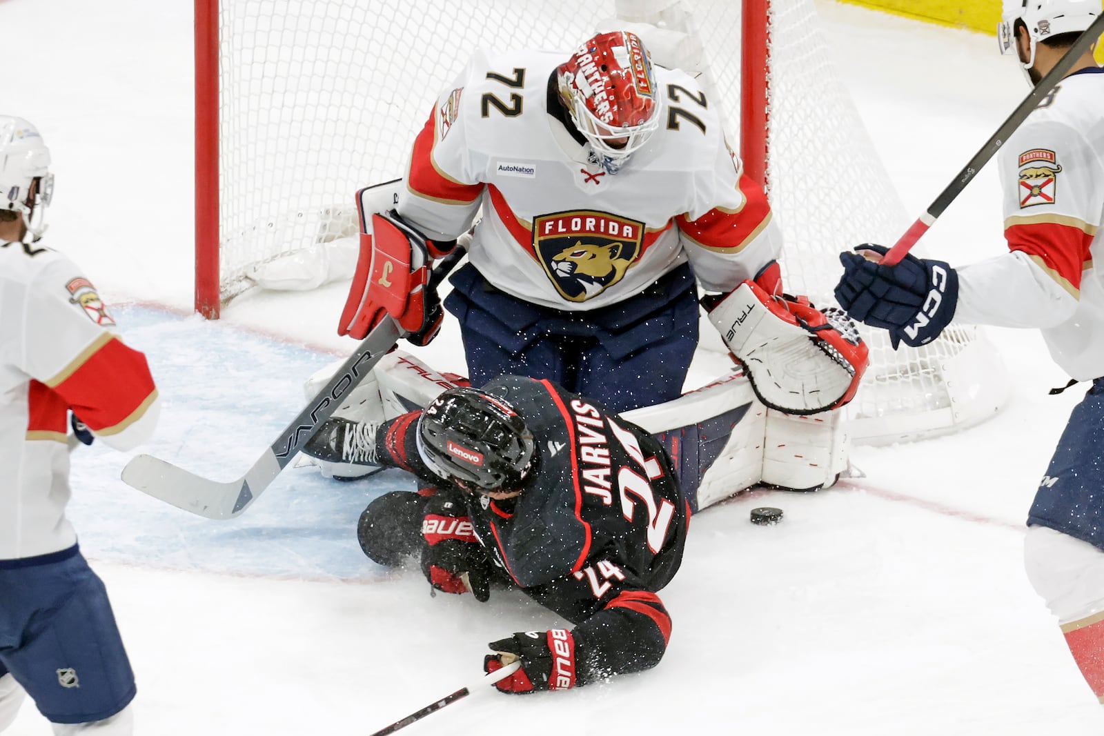 Carolina Hurricanes center Seth Jarvis (24) crashes into Florida Panthers goaltender Sergei Bobrovsky (72) during the second period of Game 5 of the NHL hockey Stanley Cup Eastern Conference finals Wednesday, May 28, 2025, in Raleigh, N.C. (AP Photo/Chris Seward)