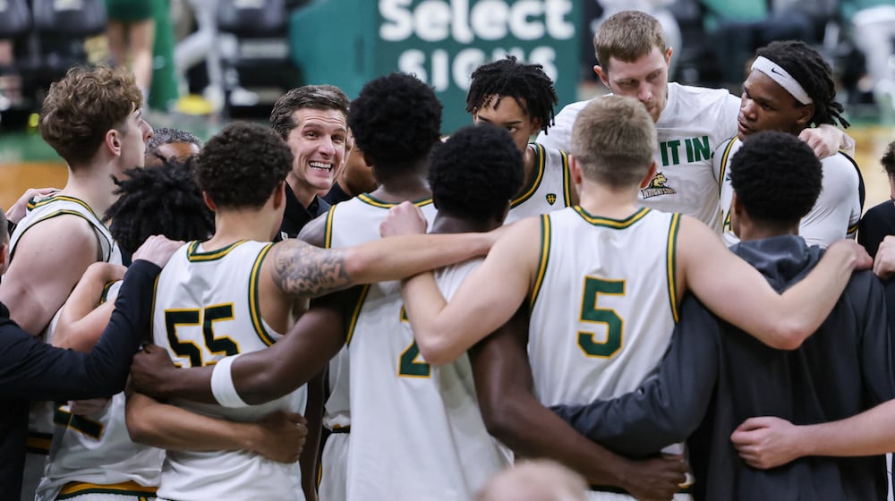 Wright State coach Clint Sargent (center left) talks to players during a huddle before the start of the second half of a Horizon League Championship first-round game against Cleveland State on Wednesday, March 4 at Ervin J. Nutter Center in Fairborn. BRYANT BILLING / STAFF