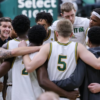 Wright State coach Clint Sargent (center left) talks to players during a huddle before the start of the second half of a Horizon League Championship first-round game against Cleveland State on Wednesday, March 4 at Ervin J. Nutter Center in Fairborn. BRYANT BILLING / STAFF