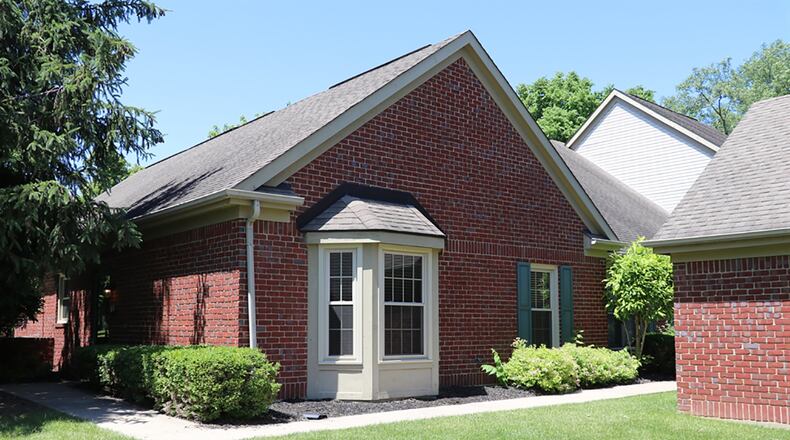 The brick ranch condominium has about 1,150 sq. ft. of living space. It is one of a 5-unit building, and the condo comes with a 2-car, detached garage. The great room has a vaulted ceiling and bay bump-out. CONTRIBUTED PHOTO BY KATHY TYLER