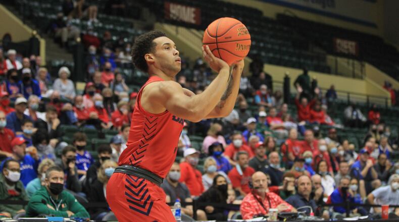 Dayton's Lynn Greer III makes a 3-pointer against Belmont on Sunday, Nov. 28, 2021, in the championship game of the ESPN Events Invitational at HP Fieldhouse in Kissimmee, Fla. David Jablonski/Staff