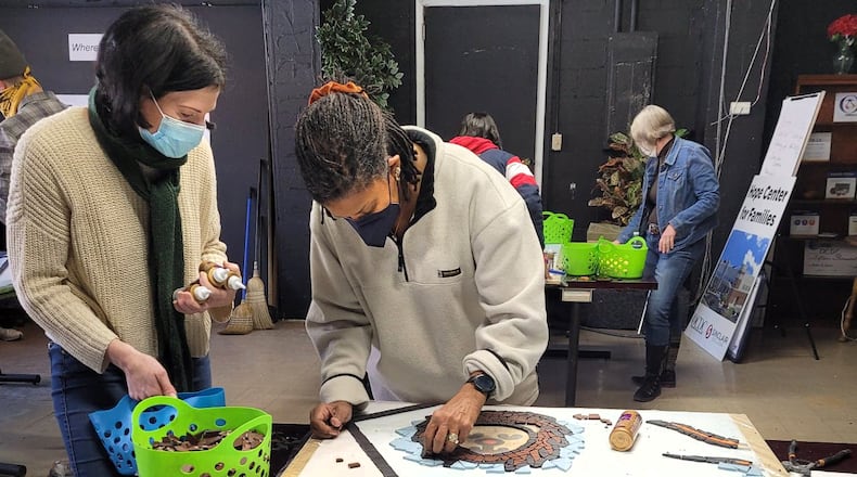 Volunteers have begun assembling “Together We Rise,” a 400-square-foot play station, will be installed at the Hope Center for Families, 1800 Harvard Blvd. in Dayton later this summer.  MOSAIC INSTITUTE OF DAYTON