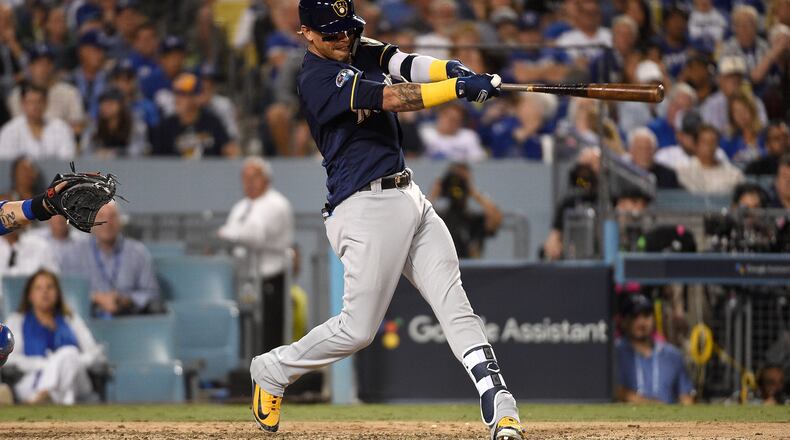 LOS ANGELES, CA - OCTOBER 15:  Orlando Arcia #3 of the Milwaukee Brewers hits a two-run home run over the right field wall during the seventh inning of Game Three of the National League Championship Series against the Los Angeles Dodgers at Dodger Stadium on October 15, 2018 in Los Angeles, California.  (Photo by Kevork Djansezian/Getty Images)