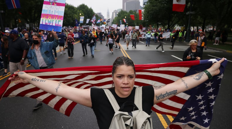 FILE - Demonstrators march down Benjamin Franklin Parkway during the "No Kings" protest, June 14, 2025, in Philadelphia. (AP Photo/Yuki Iwamura, File)