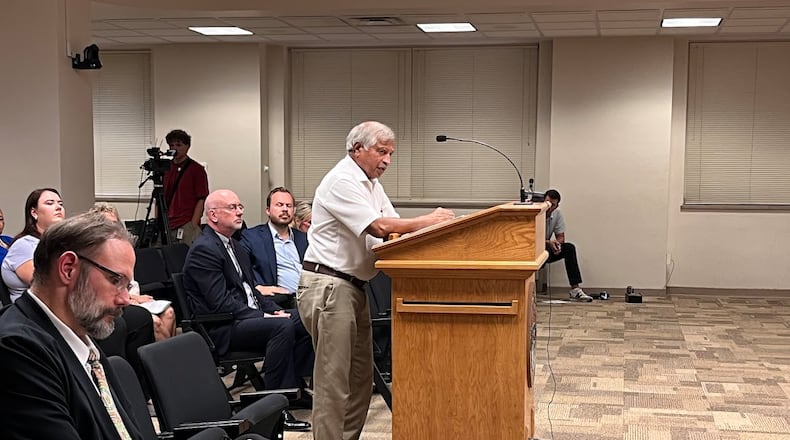 Sham Reddy, a Dayton-area Realtor, speaks with representatives of the Public Utilities Commission of Ohio Thursday Aug. 14, 2025 at the Dayton Municipal Building. THOMAS GNAU/STAFF