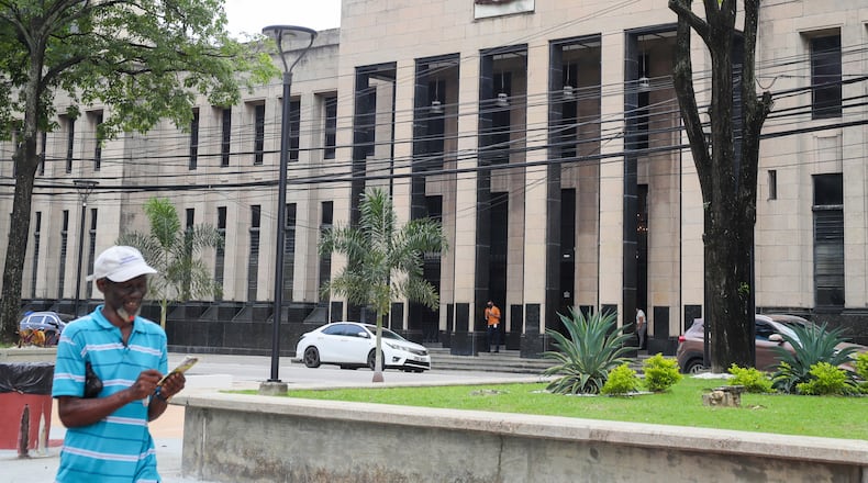 FILE - The country's coat of arms is displayed on the facade of a government building in Port-of-Spain, Trinidad and Tobago, Aug. 20, 2024. (AP Photo/Ash Allen, File)