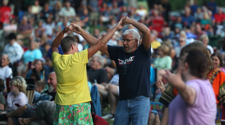 Bud and Yvonne Bell showed the crowd some dance moves as they danced to the music of the K-Tel All-Stars during the opening night of the abbreviated 2021 Summer Arts Festival at Veteran's Park. BILL LACKEY/STAFF